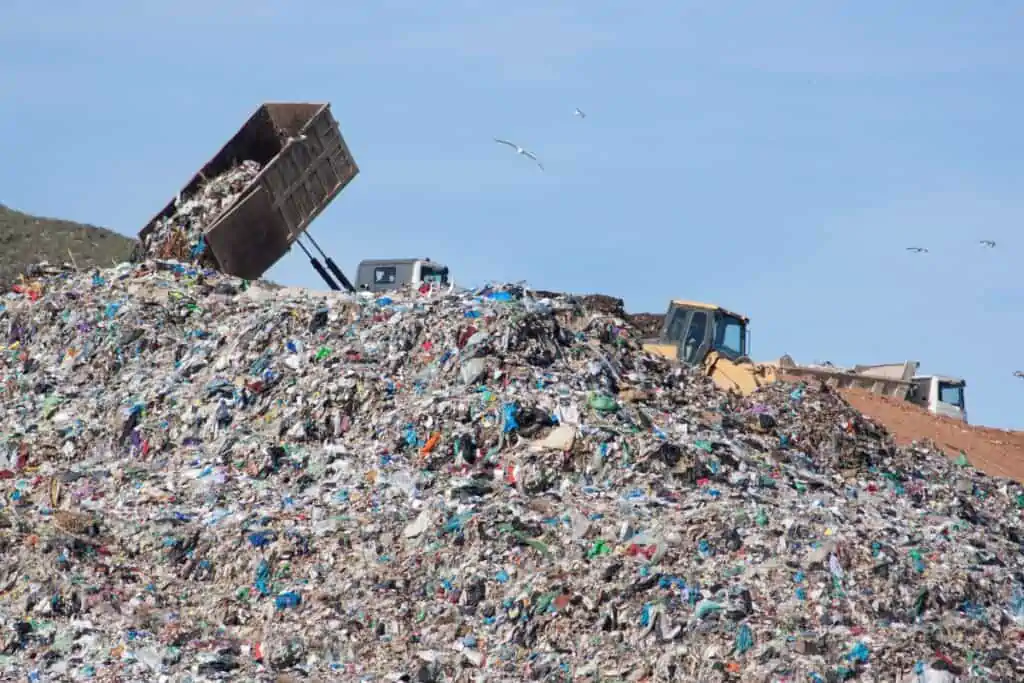 a mountain of rubbish at a landfill