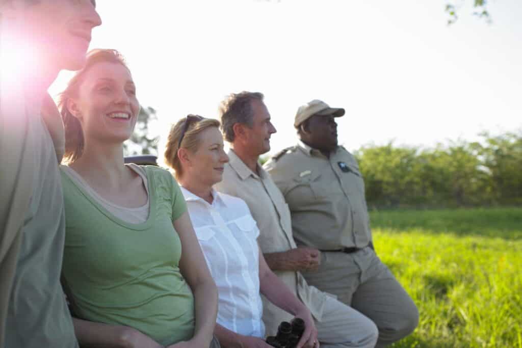 tour guide standing with a group of people outside